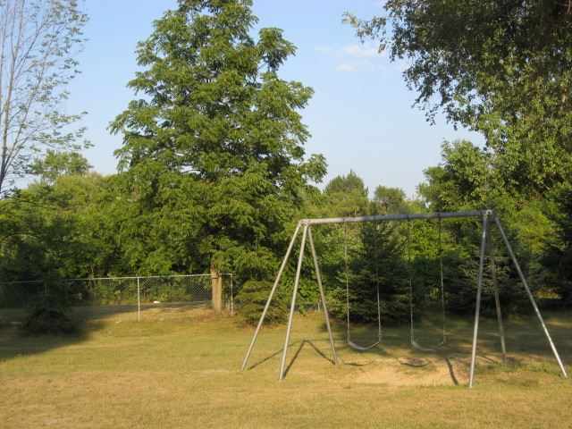 A swing set at Franklin D. Adams Park
