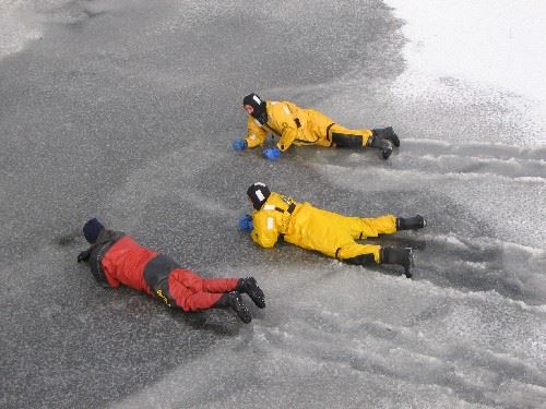 Firefighters practice moving around on thin ice